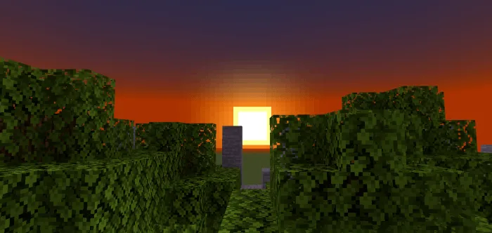 Pixelated sunset over blocky green trees.