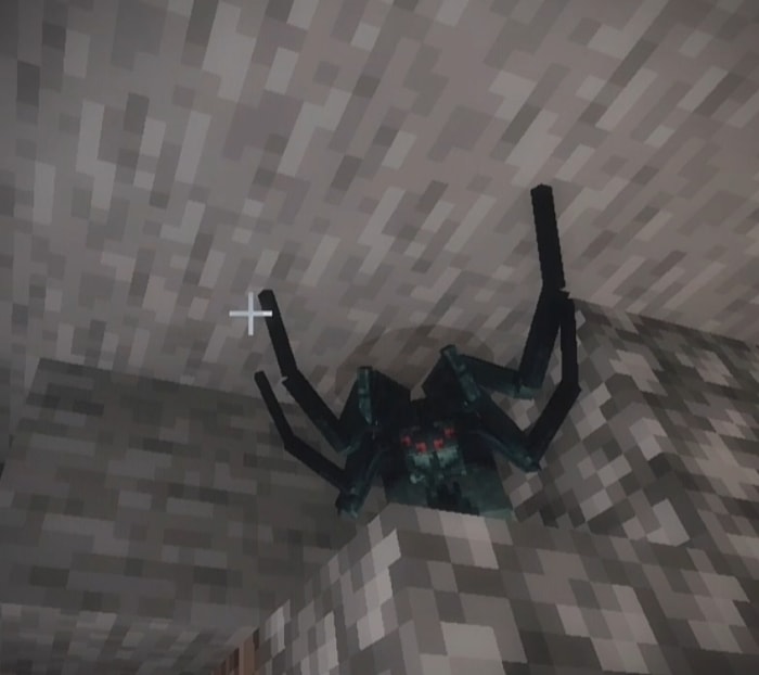Creepy mod spider in cave ceiling.