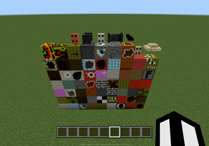 Colorful blocks and items on grass field.