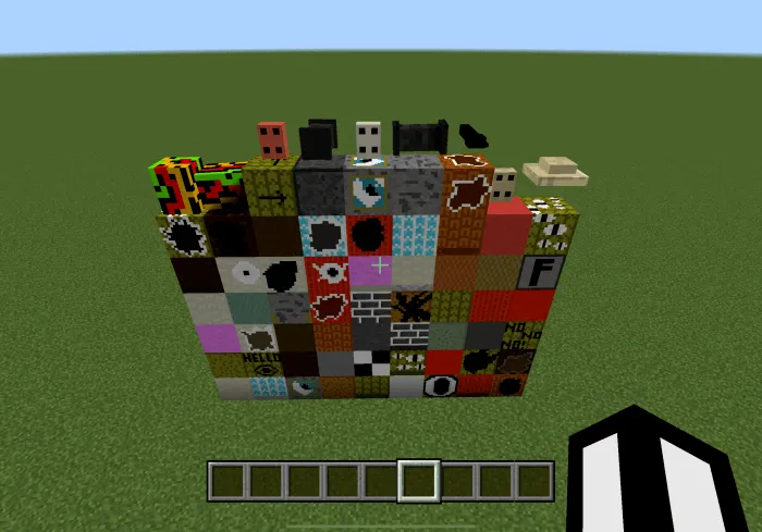 Colorful blocks and items on grass field.