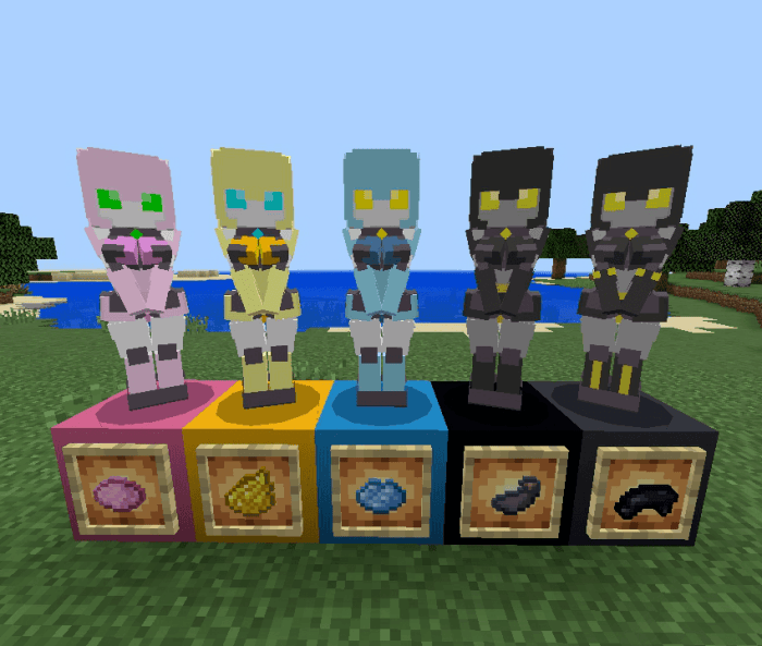 Five colorful robot statues on blocks.