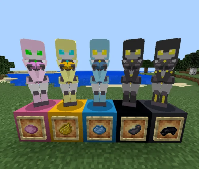 Five colorful robot statues on blocks.