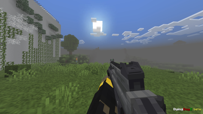 Gun aimed at landscape with sun and mist.