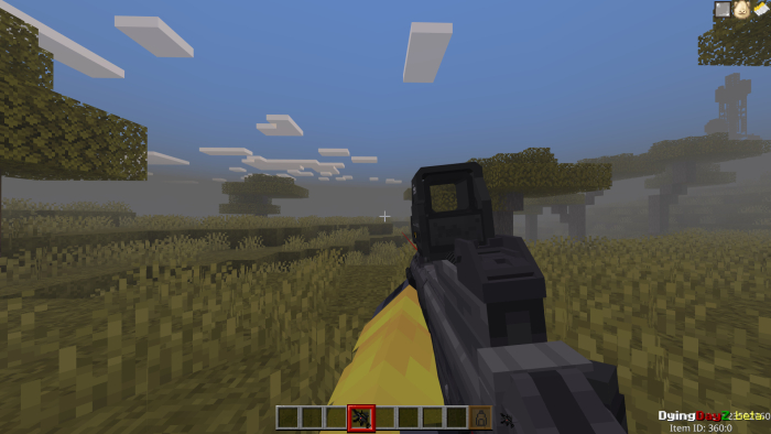 First-person view aiming in grassy landscape.