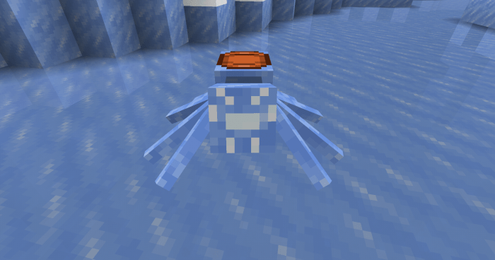 Blue spider with saddle on icy terrain.