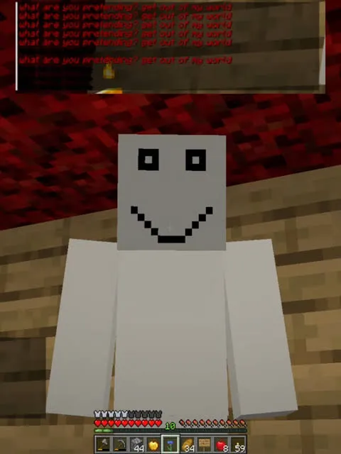 Blocky white figure with unsettling smile