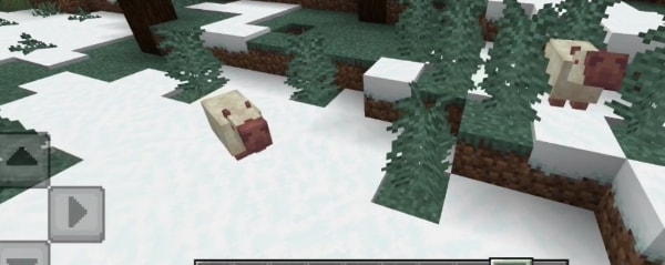 Two capybaras in a snowy forest biome