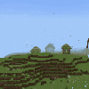 Three small houses on a grassy hillside