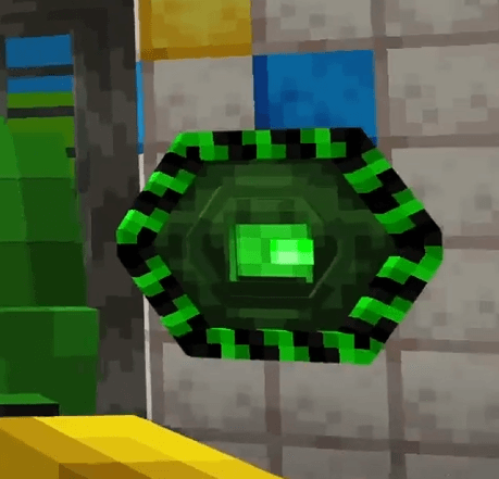 Green glowing device on a block wall.