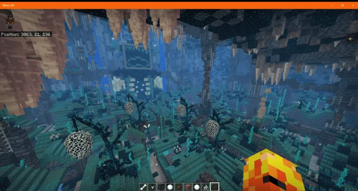 Glowing cave with blue fog and spore plants