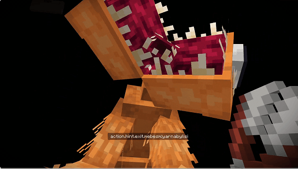 Blocky monster with open jaws.