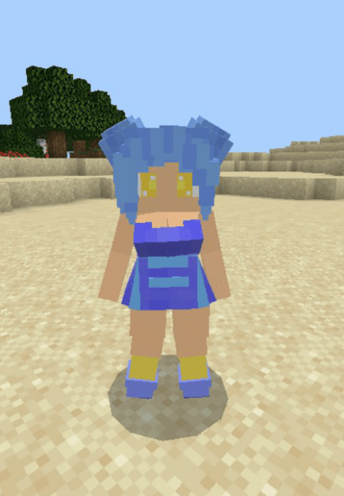 Pixelated mermaid character on sand.