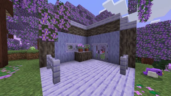 Purple-themed house in a vibrant forest.