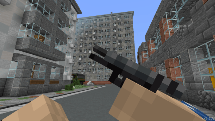 Blocky gun held in city street scene