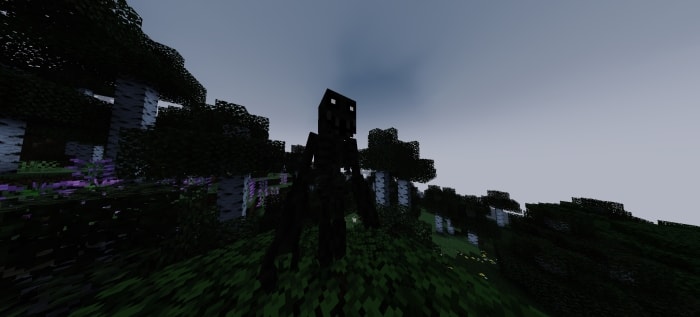 Shadowy creature standing in a dark forest
