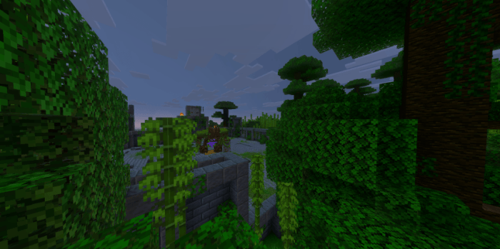 Dense jungle with stone structures.