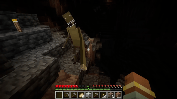 Tall, eerie creature lurking in a dark cave