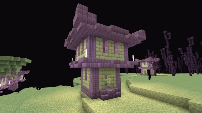 Purple tower on a sandy landscape.