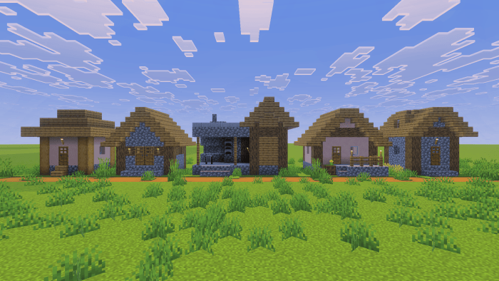 Screenshot showing three small houses, a weaponsmith, and a mason’s house along a dirt path.