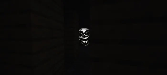 Creepy glowing face lurking in dark hallway