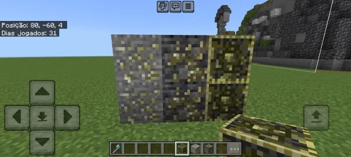 Four new textured ore blocks on grass.