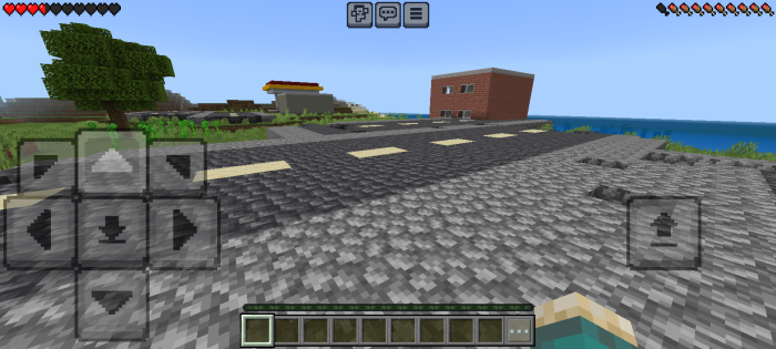 Cracked road and ruined buildings by water