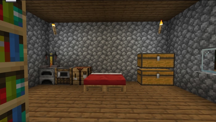 Cozy stone room with bed and storage chests
