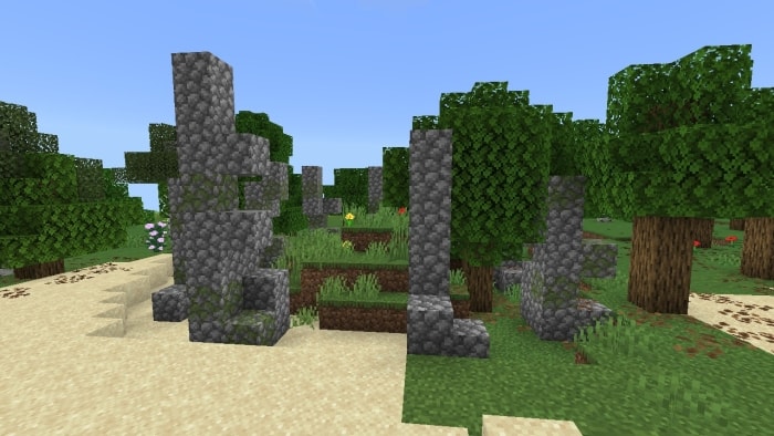 Stone ruins in a forest setting.