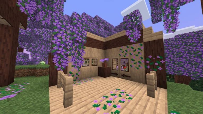 Wooden house with hanging purple flowers.