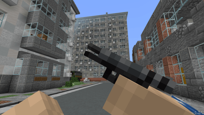 Blocky handgun held in a city street scene