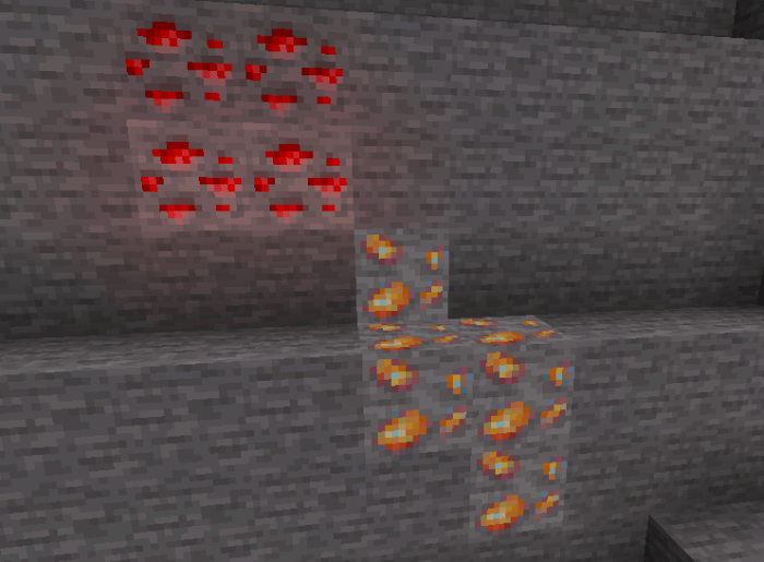Glowing orange ore embedded in stone.