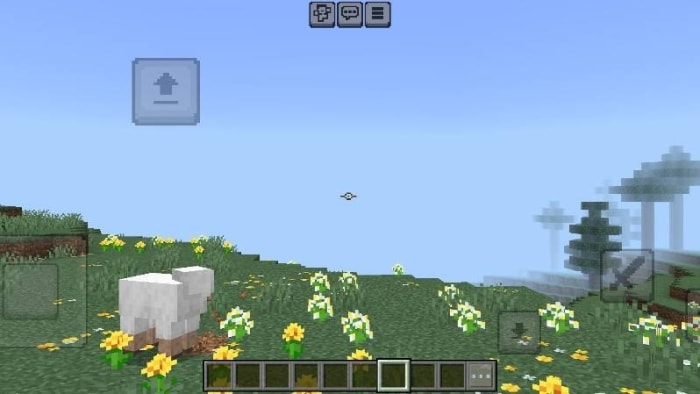 Small crosshair over grassy field with sheep