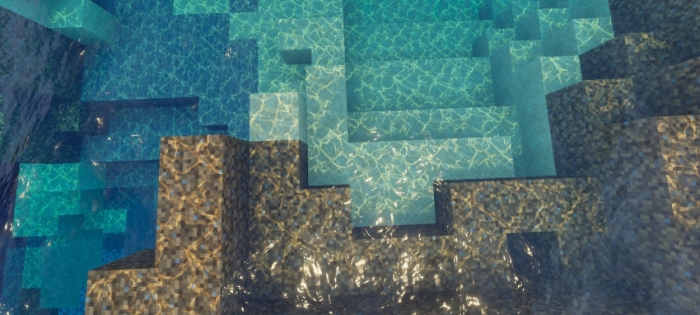 Crystal-clear, vibrant water over blocky terrain