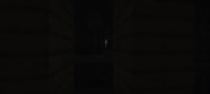 Creepy face lurking in a dark hallway