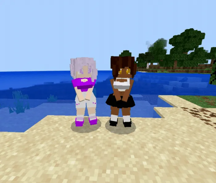 Two mermaid characters on a beach.