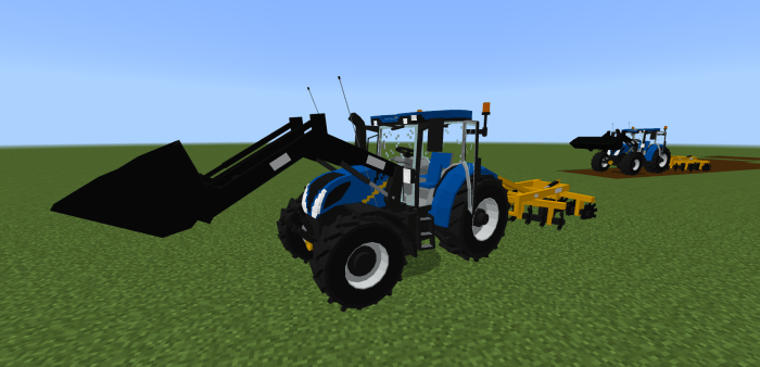 Tractors on a grassy field in-game.