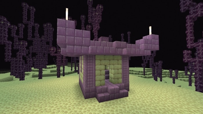 Purple ruin structure in a barren landscape.