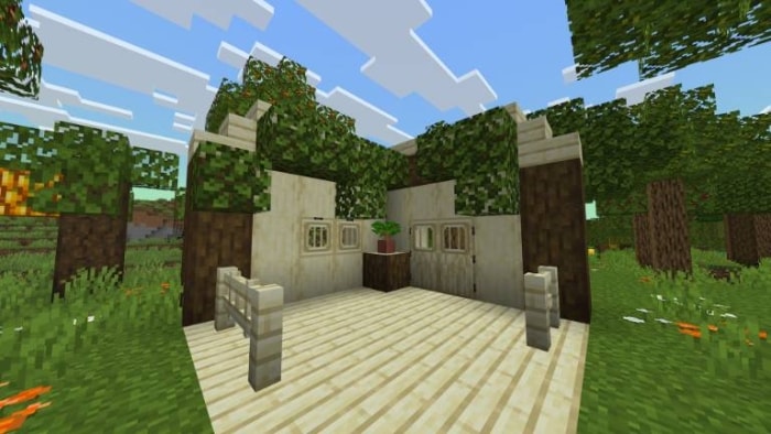 Wooden structure in a lush forest setting.