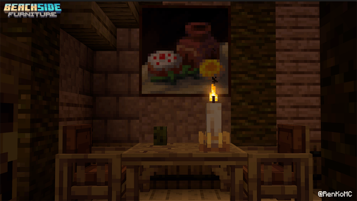 Wooden table set with candle and painting