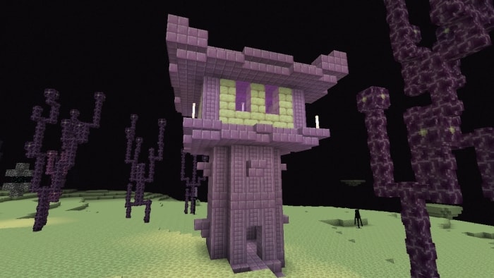 Purple tower structure in a barren landscape.