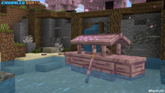 Pink wooden boat with a canopy in water.
