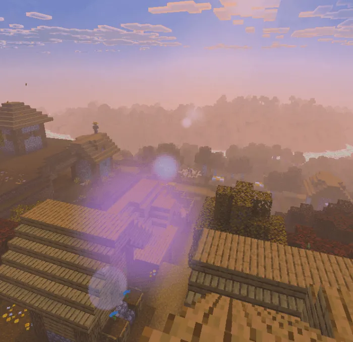 Soft sunrise glow over a pixel village