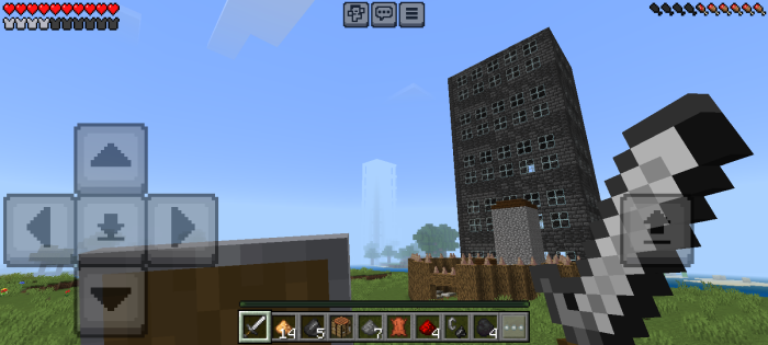 Player holding sword near tall ruined building