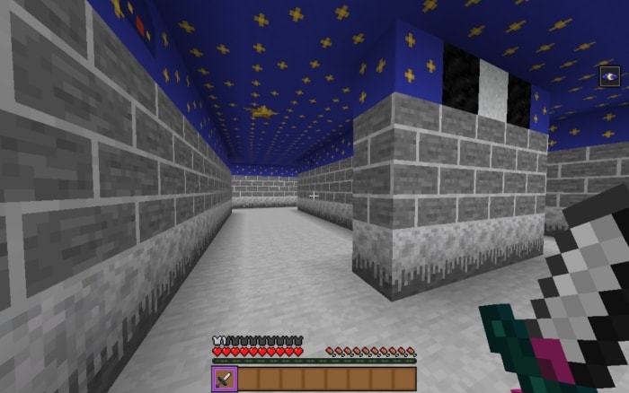 Maze-like hallway with starry blue ceiling