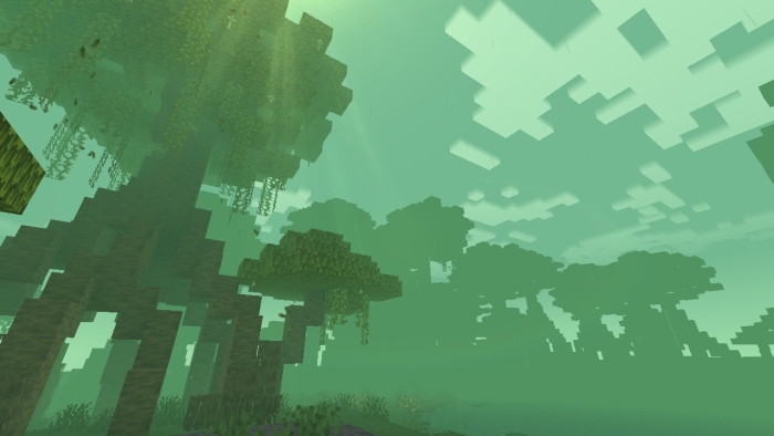 Foggy forest with tall blocky trees.