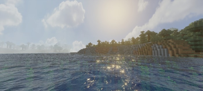 Sunlit water and vibrant shoreline scenery