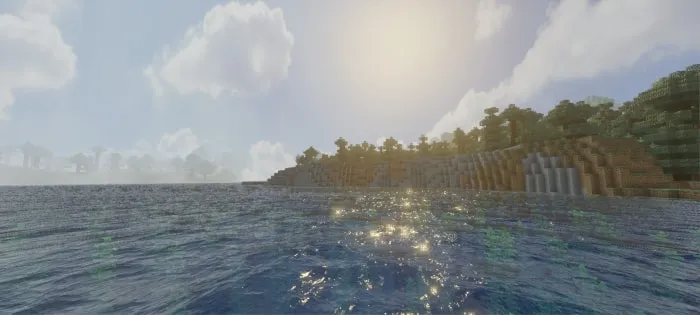 Sunlit water and vibrant shoreline scenery