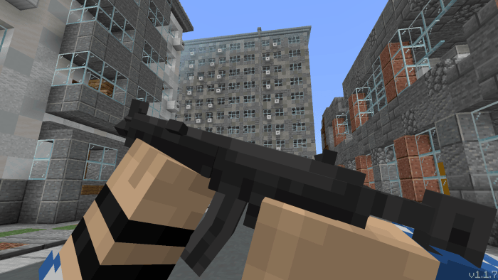 Pixelated character holding a black submachine gun