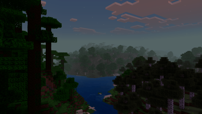 Thick atmospheric fog over a forest river.