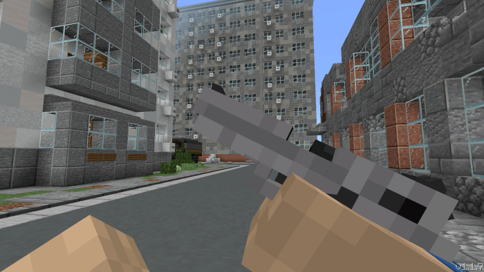 Pixelated handgun held on urban street scene